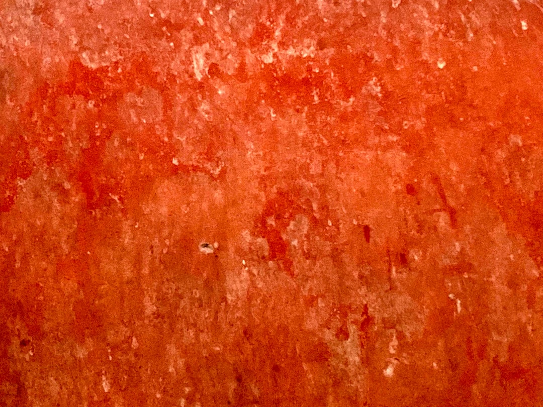 A cross-section of a glowing Himalayan salt lamp showing the crystalline structure and warm light emission